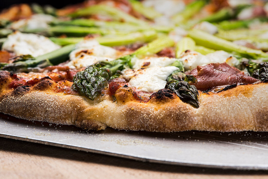 An asparagus pizza (detail)