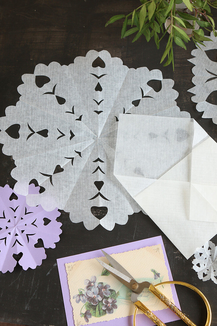 Vintage paper doilies with hand-cut patterns