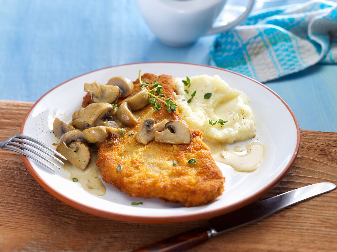 Escalope chasseur (pork escalope with mushroom sauce) with mashed celeriac