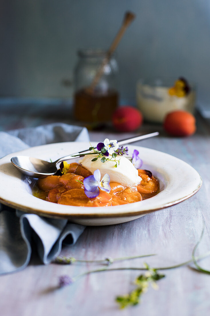 Fried apricots with mascarpone cream and edible flowers
