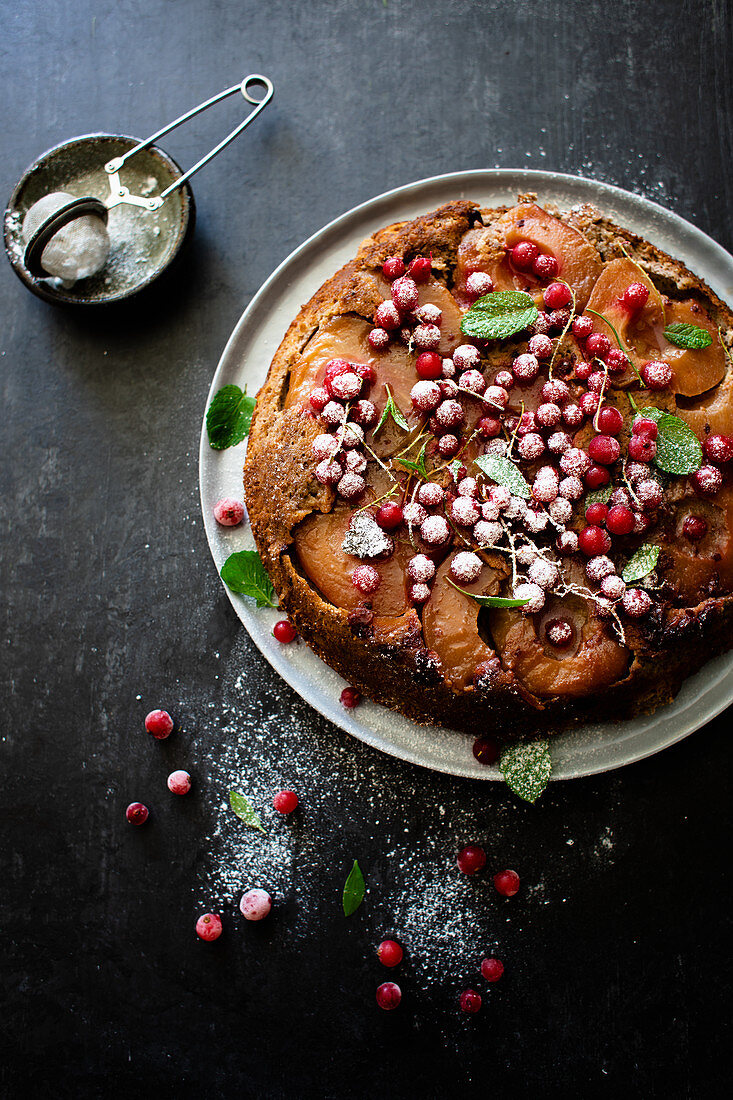 Upside down apple and walnut cake with redcurrants