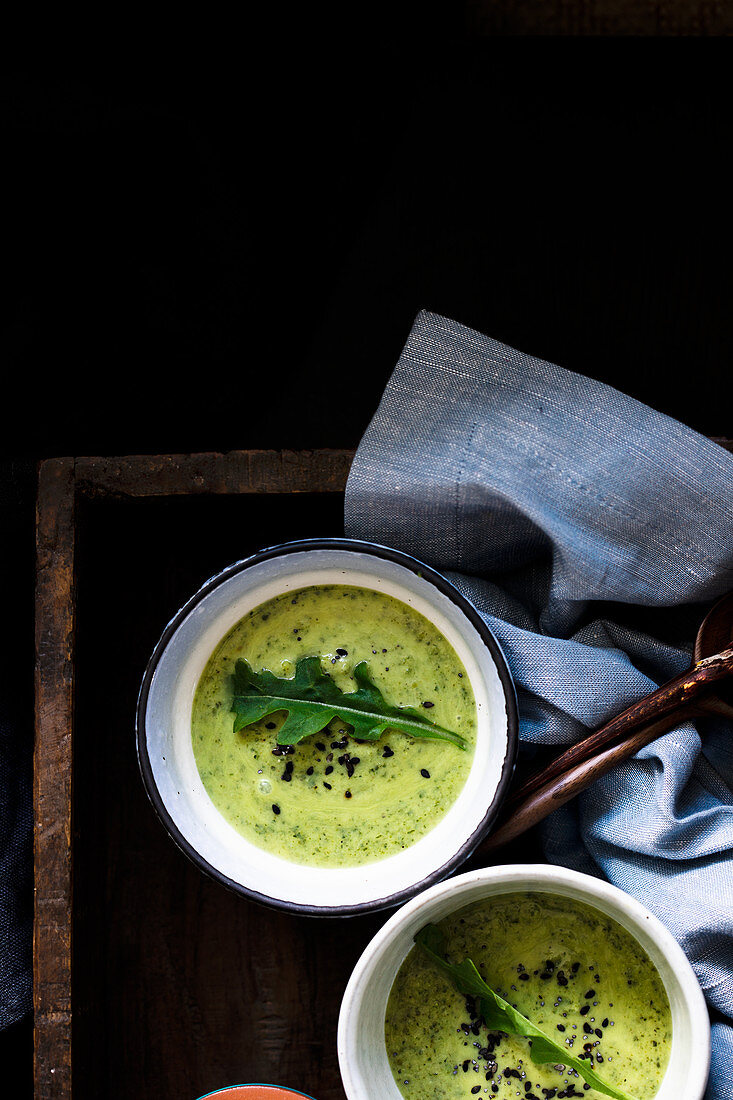 Zucchini veloute with arugula and black sesame seeds