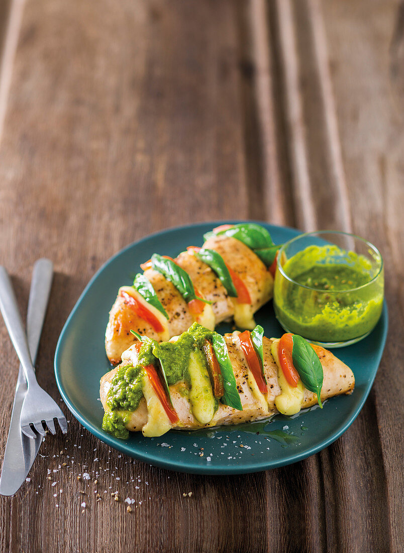 Caprese chicken breasts with basil, caper and olive dressing