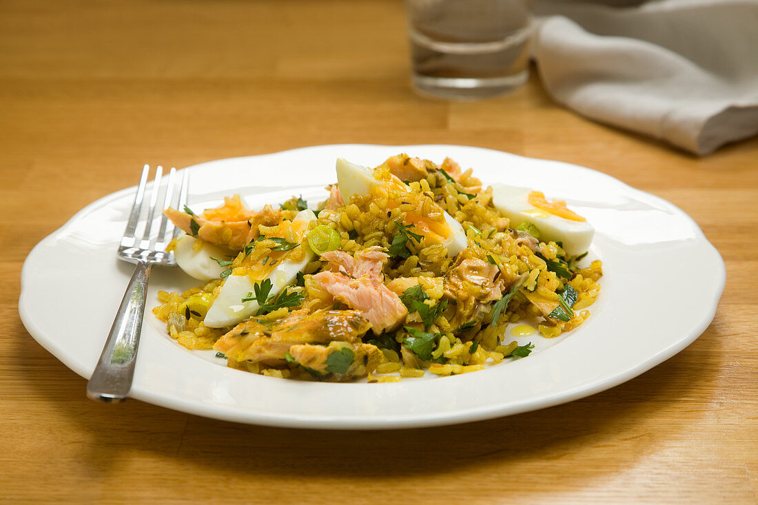 Salmon kedgeree on plate with fork (England)