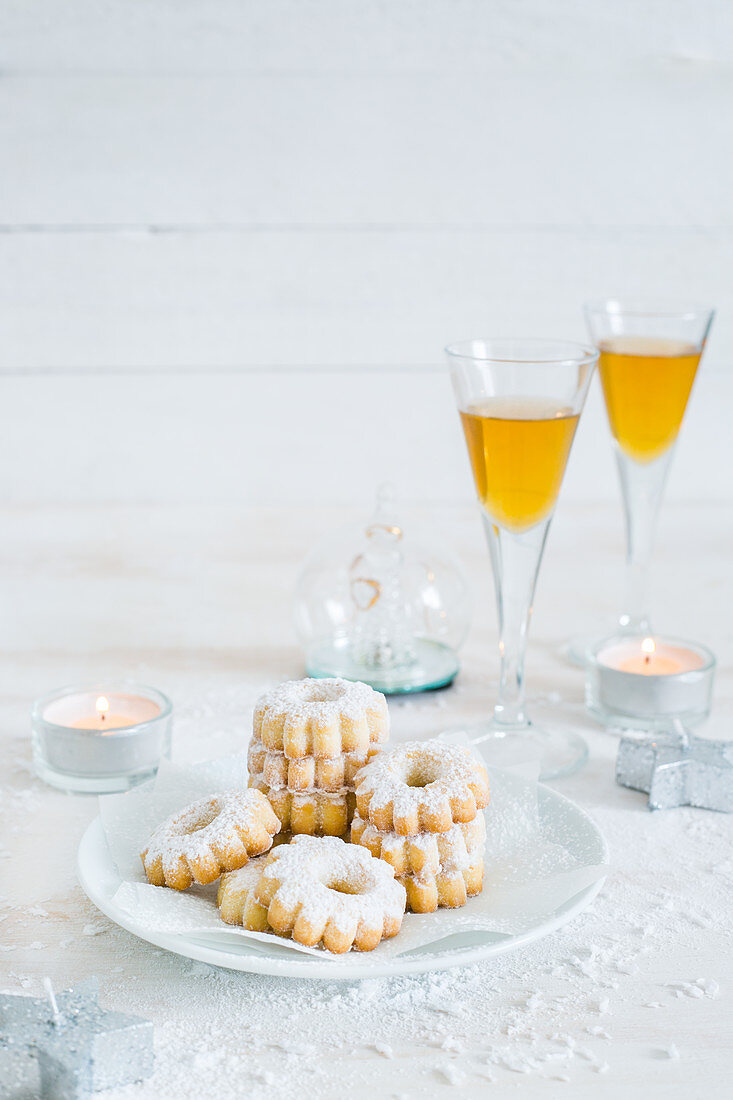 Canestrelli (almond cookies for Christmas, Italy), served with Malvasia liqueur