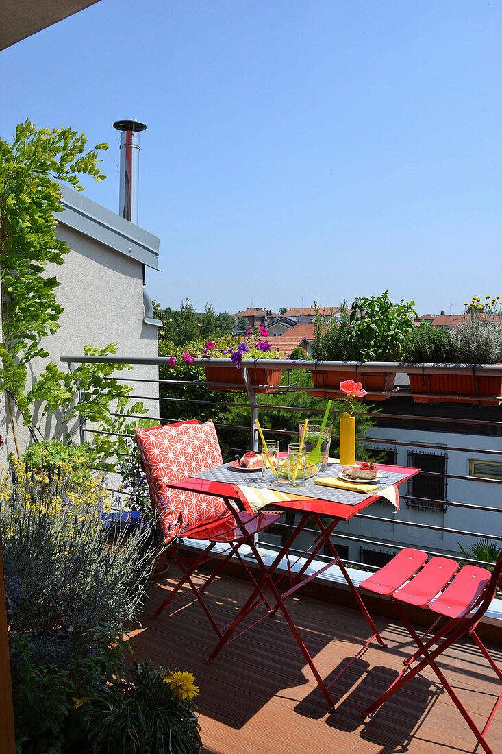 Red metal furniture on balcony