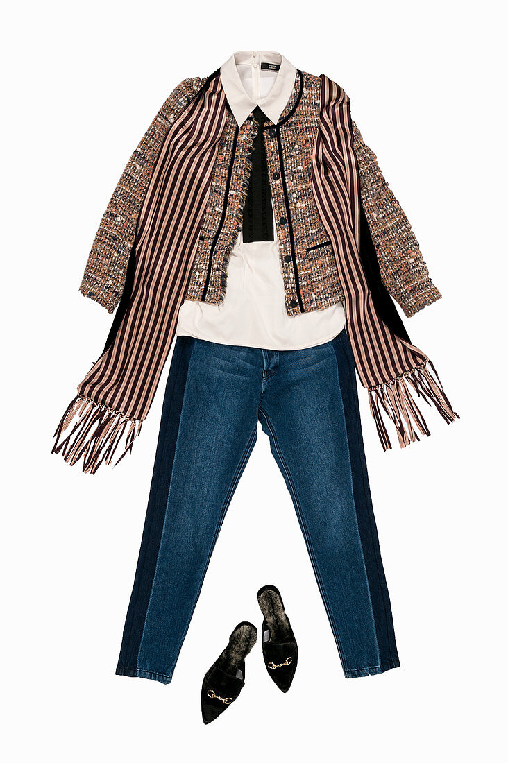 A silk blouse with a ruffled collar, jeans, a bouclé jacket and a scarf