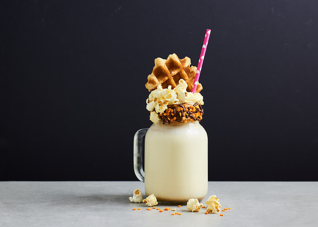 Freak Shake - Salted Caramel Milkshake with popcorn and waffle black background