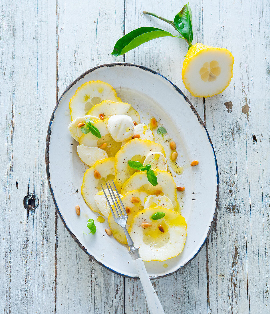 Citron carpaccio with mozzarella and pinenuts