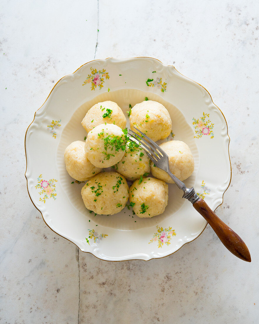 Cooked potato dumplings with parsley