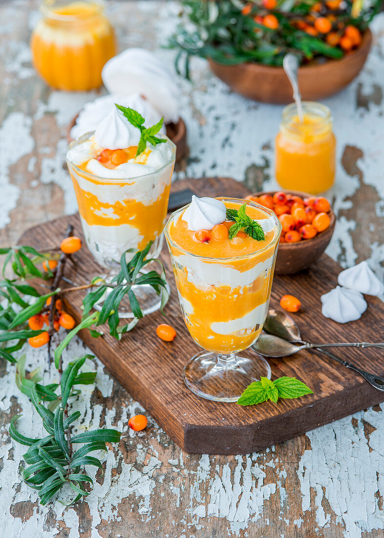 Trifles with meringue, cream and sea buckthorn curd