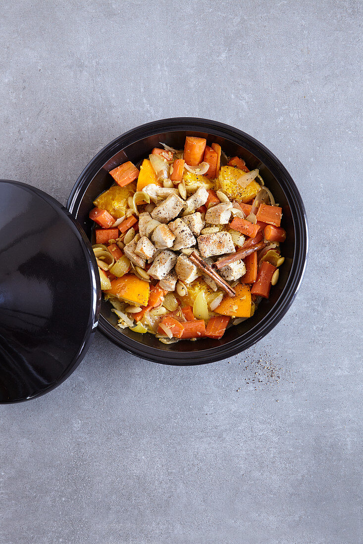 Aromatic chicken with carrots made in a tagine