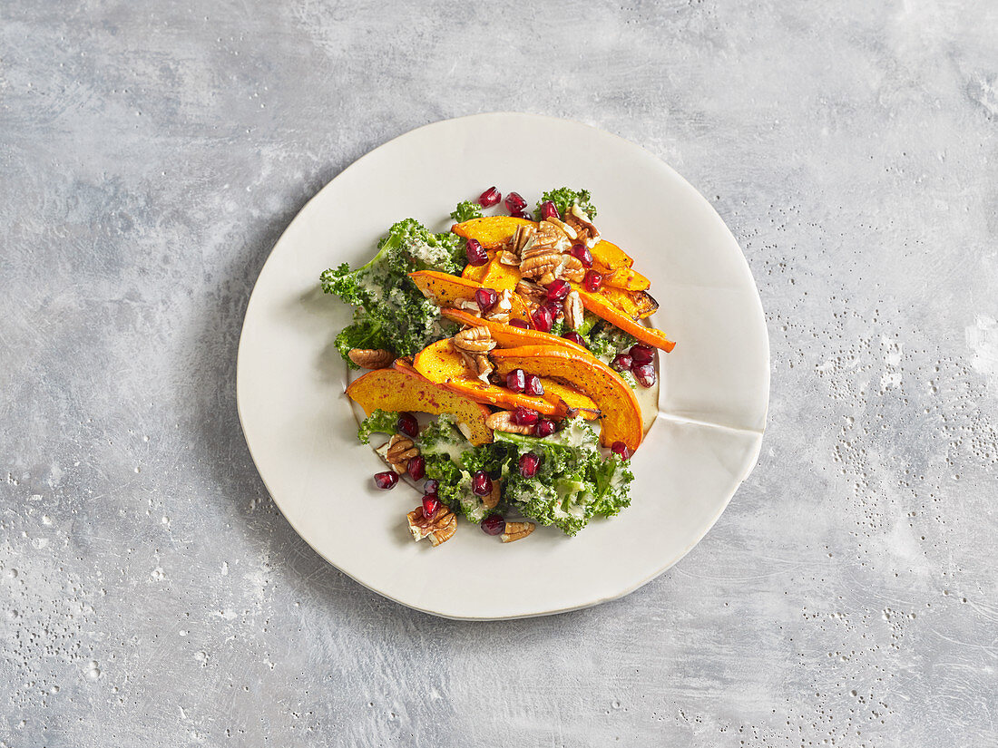 Winter kale salad with oven-baked pumpkin and pomegranate seeds