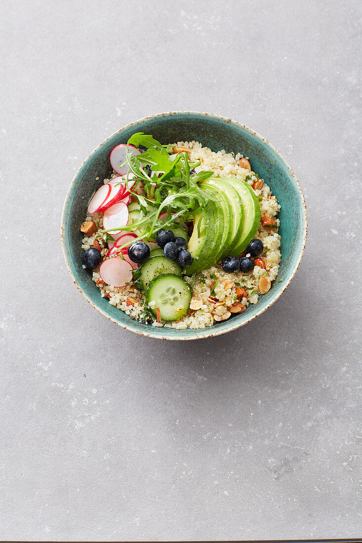Vegan quinoa avocado bowl with blueberries