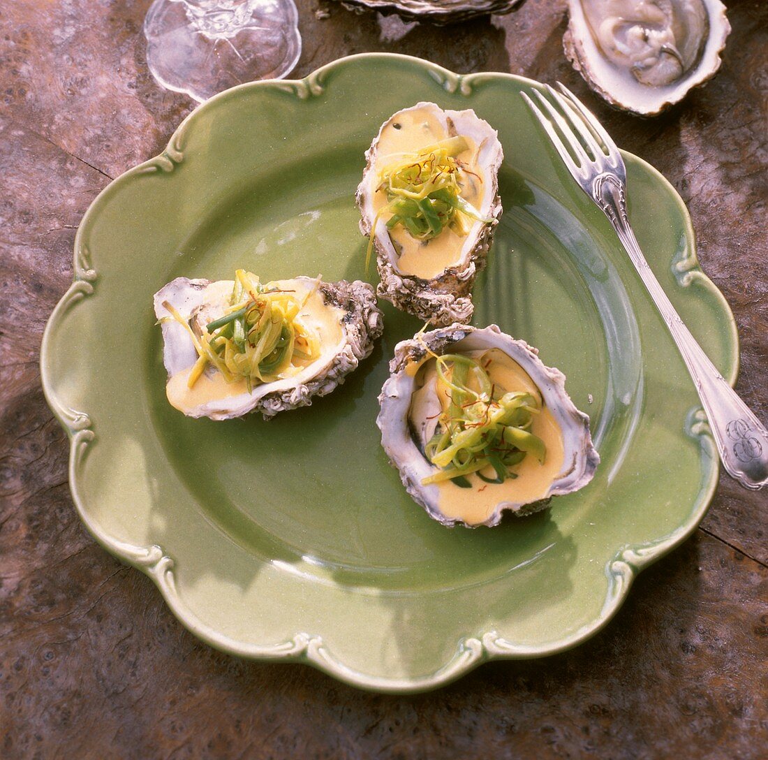 Saffron oysters with leeks on plate (from Ireland)