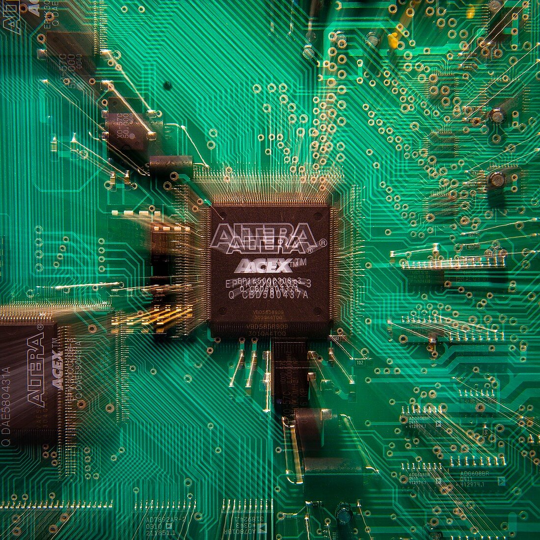 Microchip plugged into a circuit board, abstract image