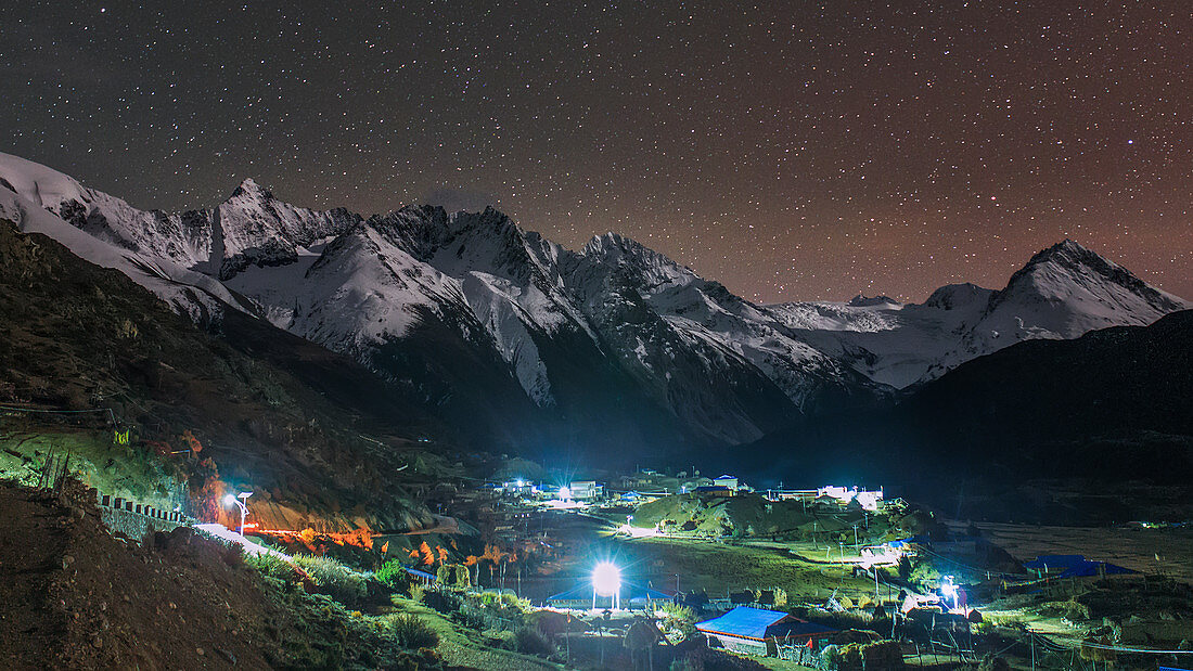 Starry night over Tibetan village