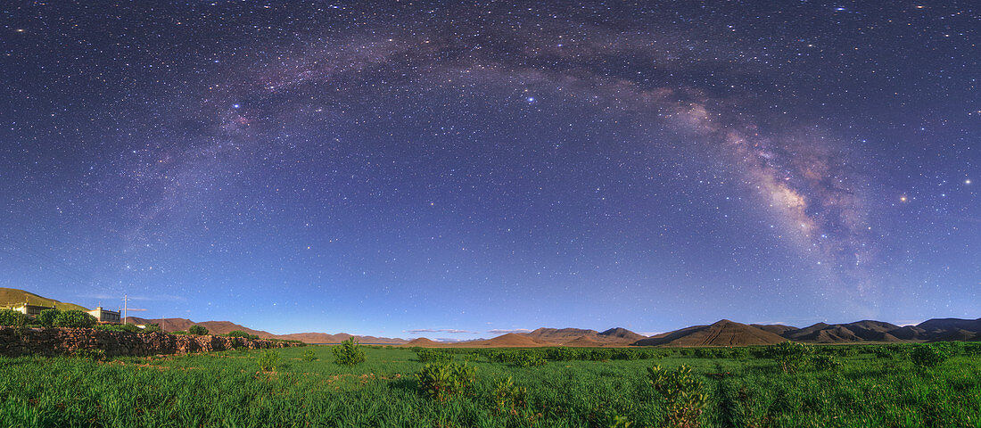 Milky Way over moonlit Tibetan field