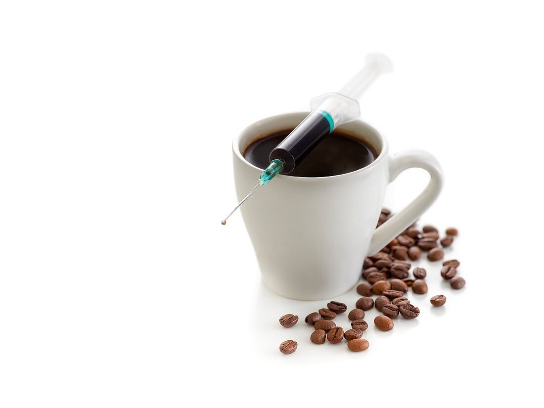 Coffee cup with beans and a syringe
