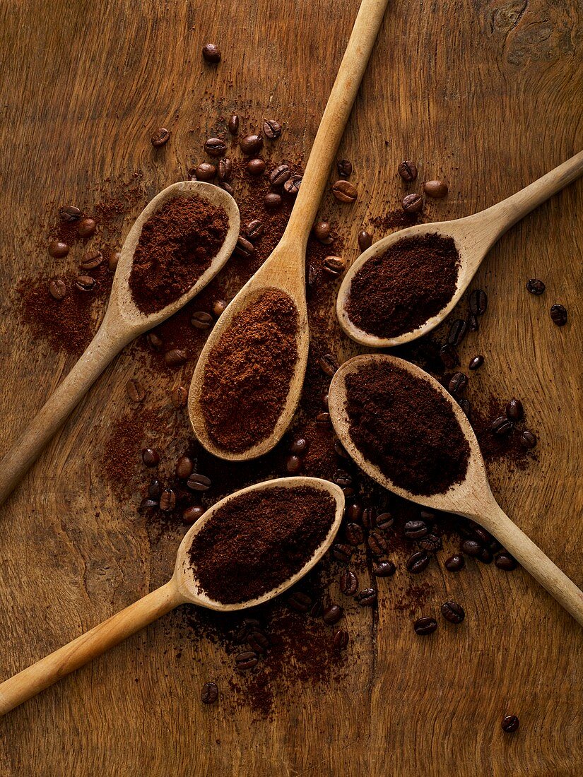 Wooden spoons with ground coffee