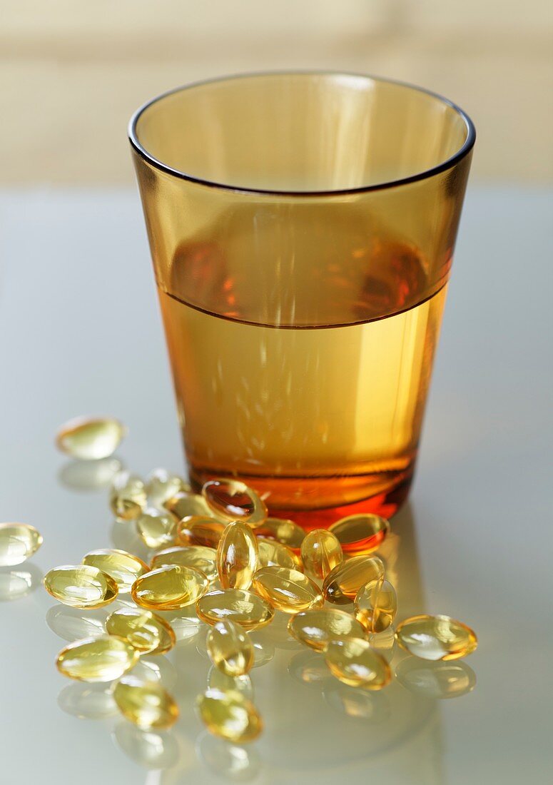 Evening primrose oil capsules and water