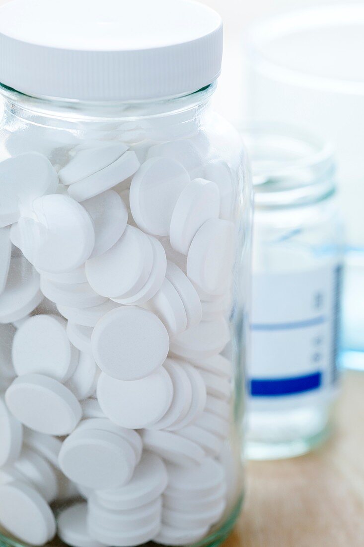 White pills in a jar