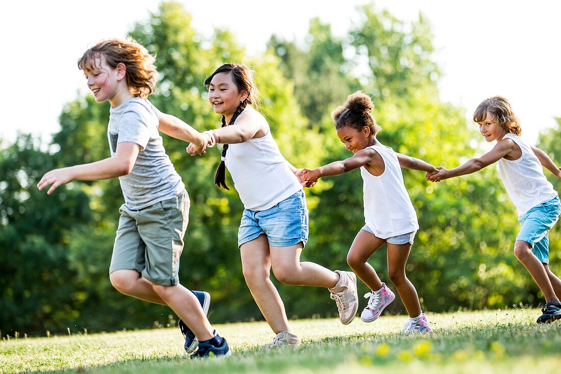 Children holding hands and running