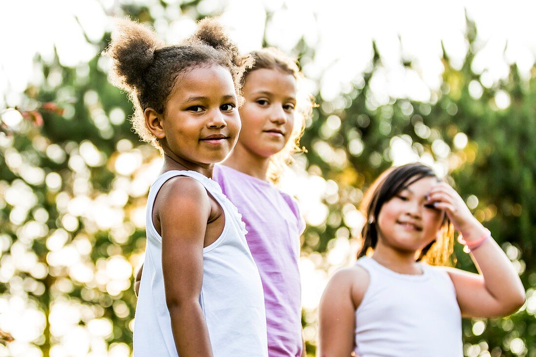 Girls smiling together in park