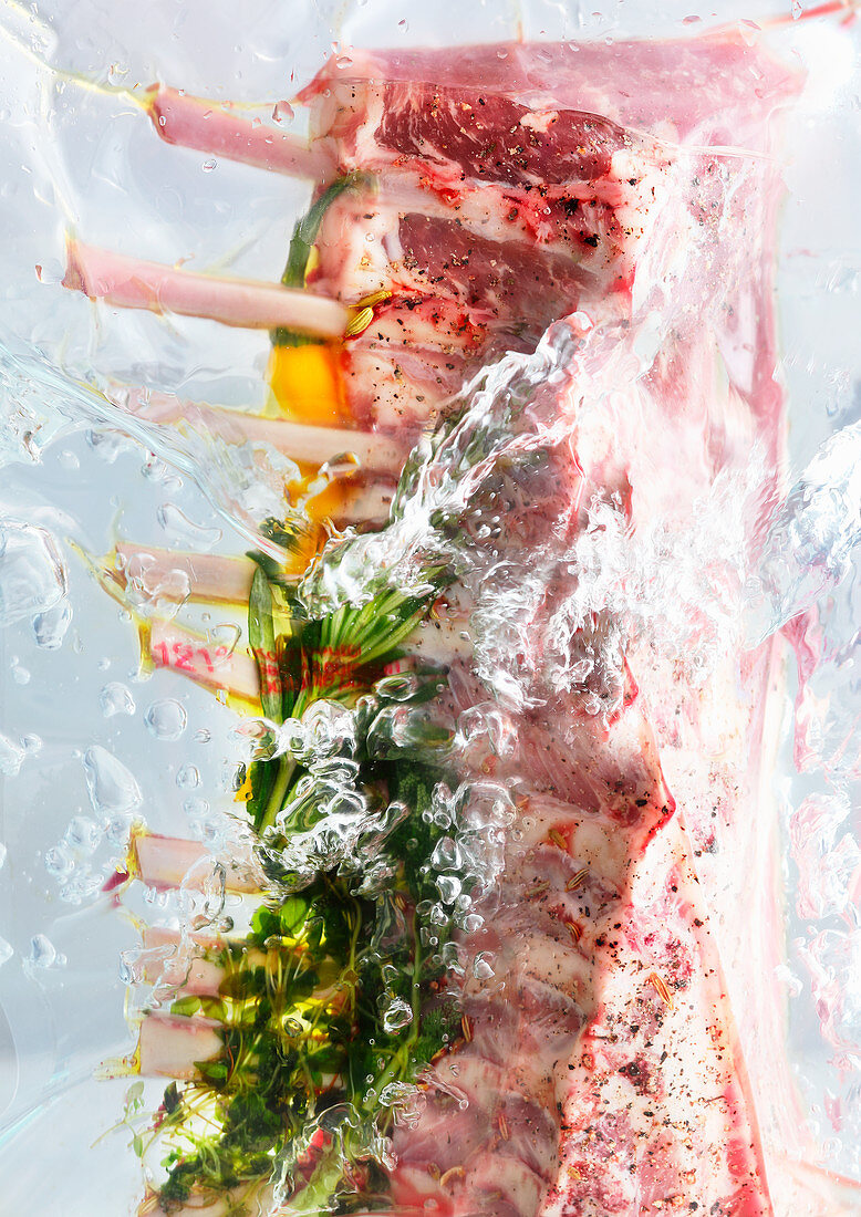 Vacuum packed saddle of lamb with herbs in water