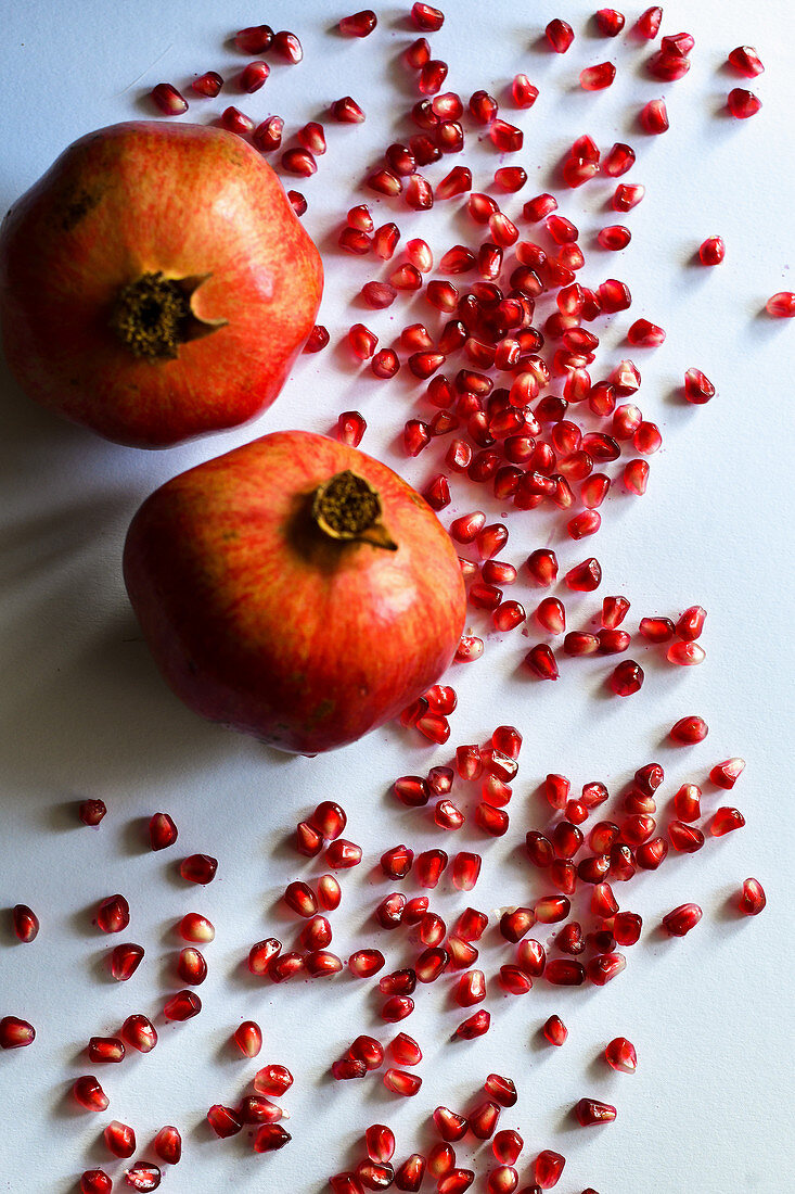 Pomegranate fruit is hiding beautiful red seeds inside its hard peel