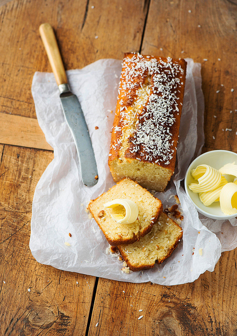 Coconut loaf cake with curls of butter