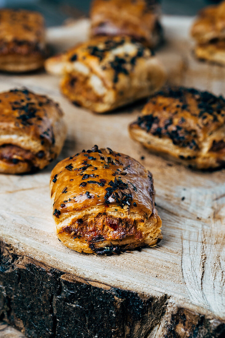Pork sausage rolls with a paprike flake topping