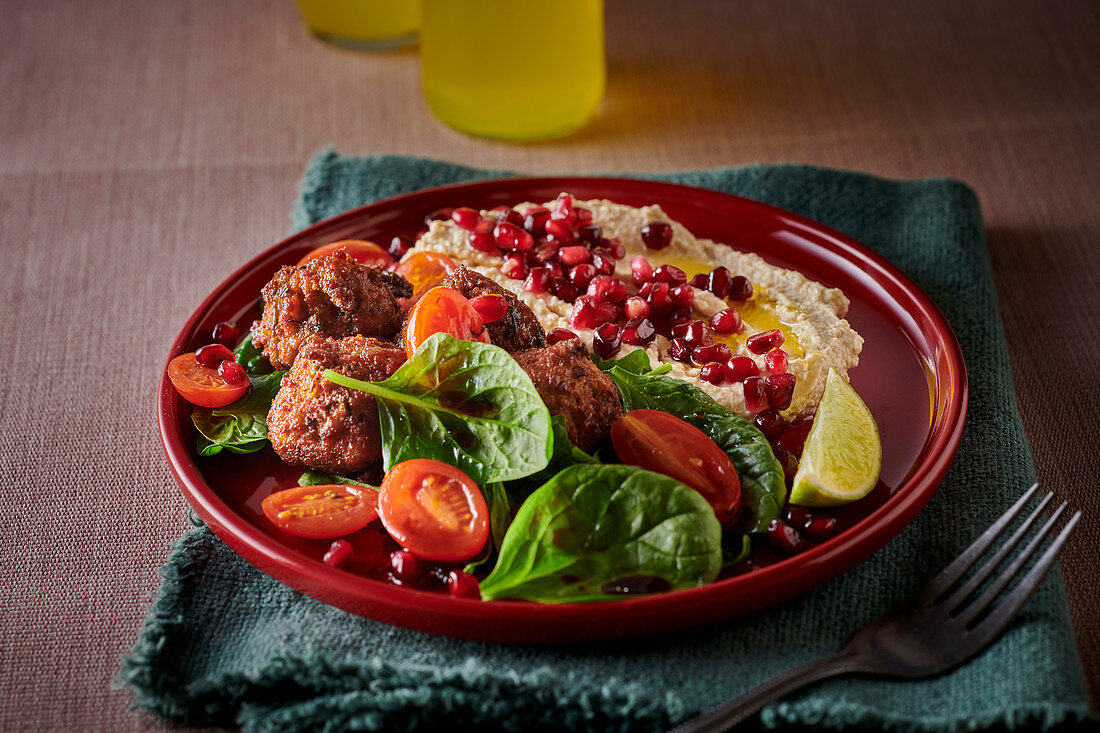 Falafel with hummus and pomegranate seeds