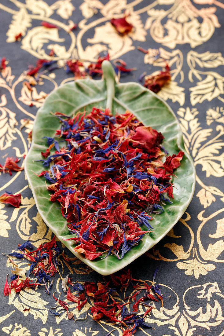 Dried cornflower and rose petals in a bowl