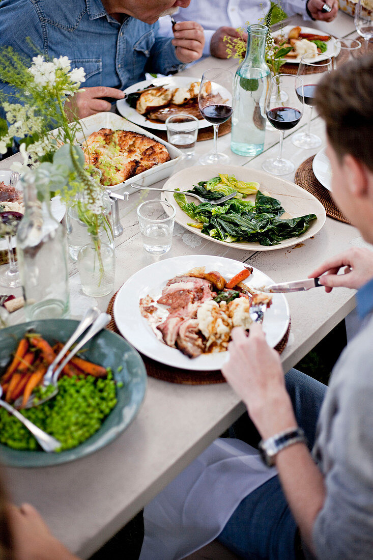 A table spread showing different dishes, Sunday lunch