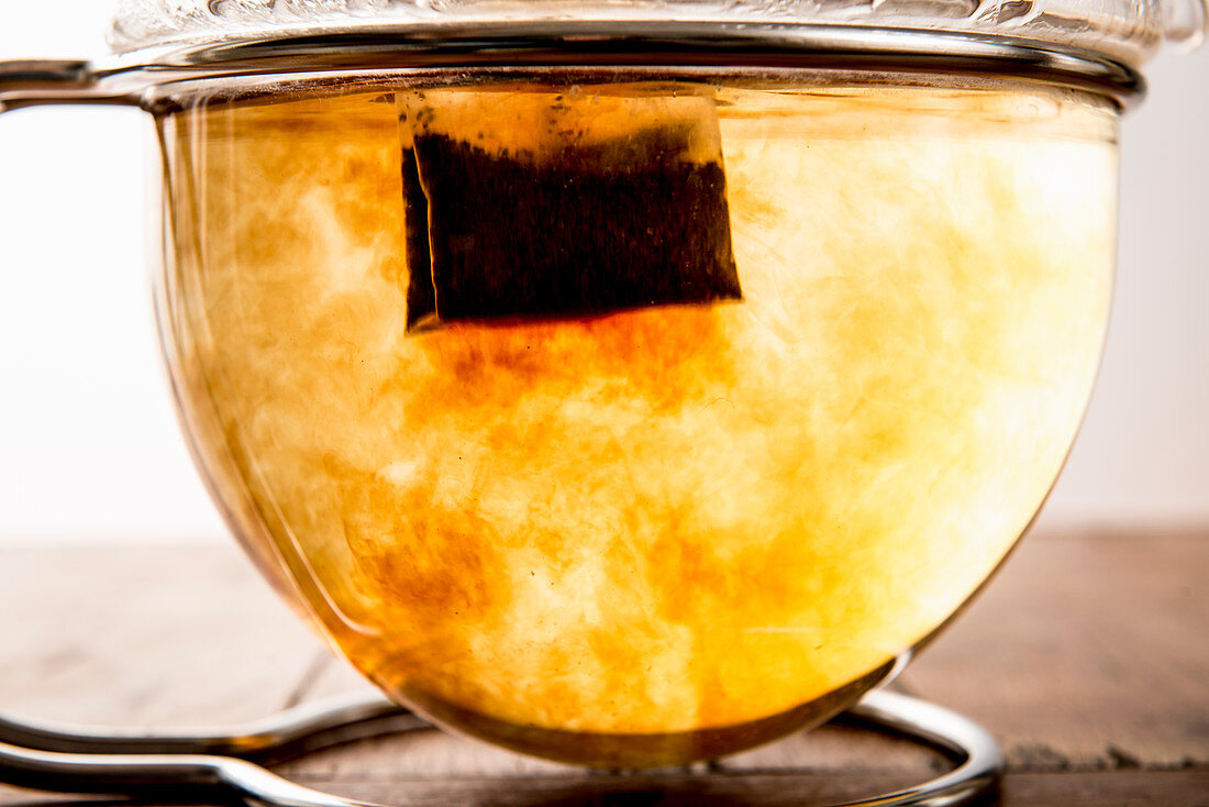 A teabag in a glass teapot