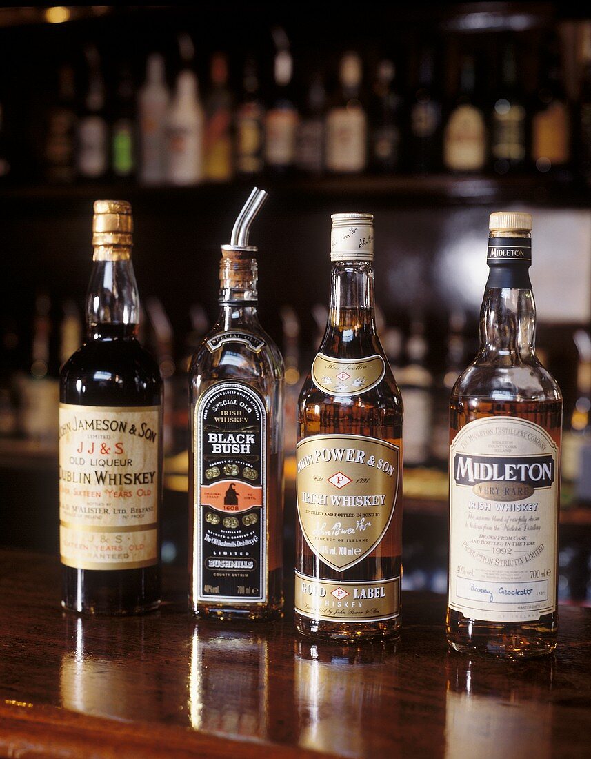 Four Irish whiskey bottles