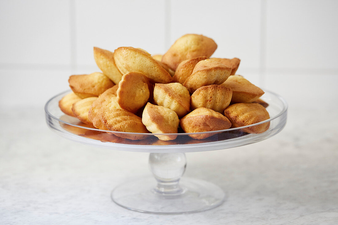 Madelines stacked on a cake stand