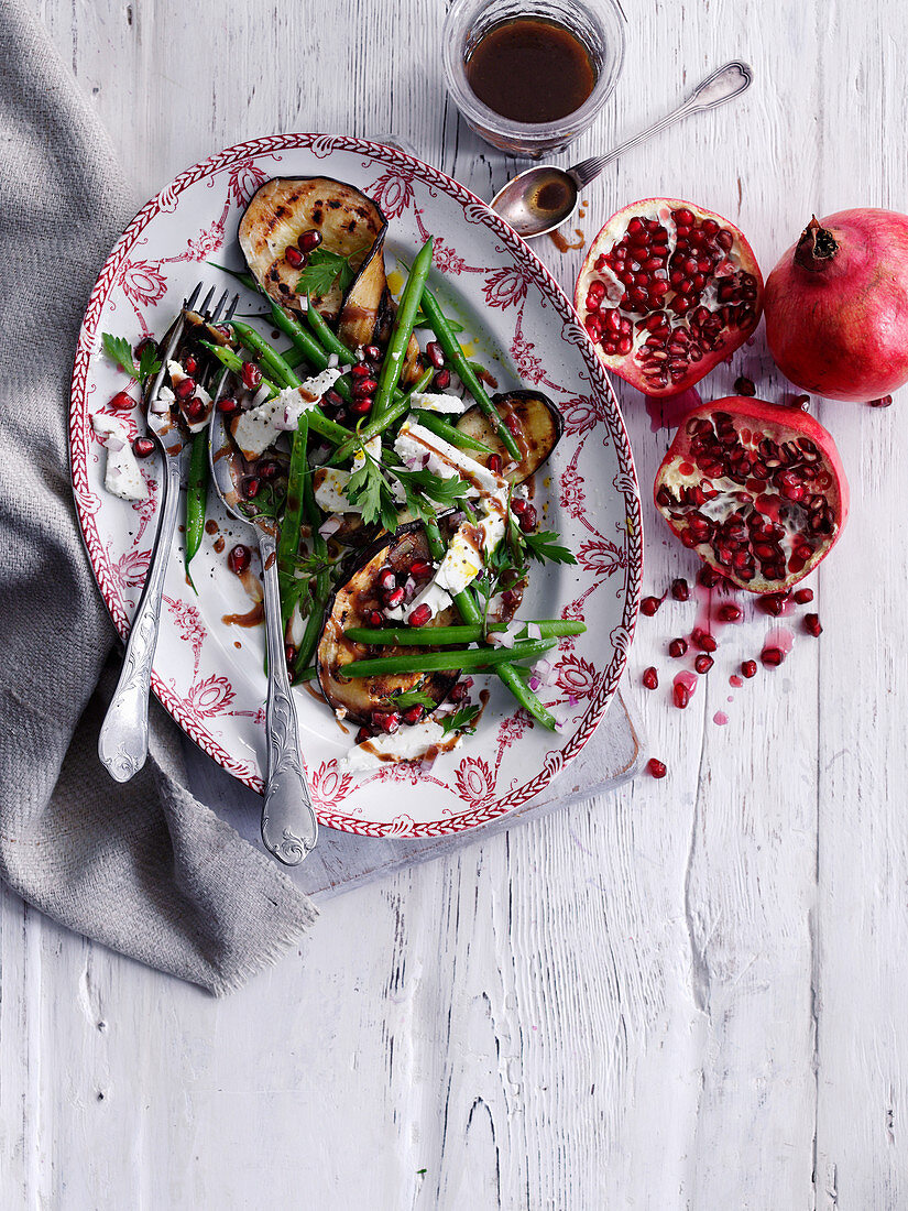 Eggplants with green beans and pomegranate