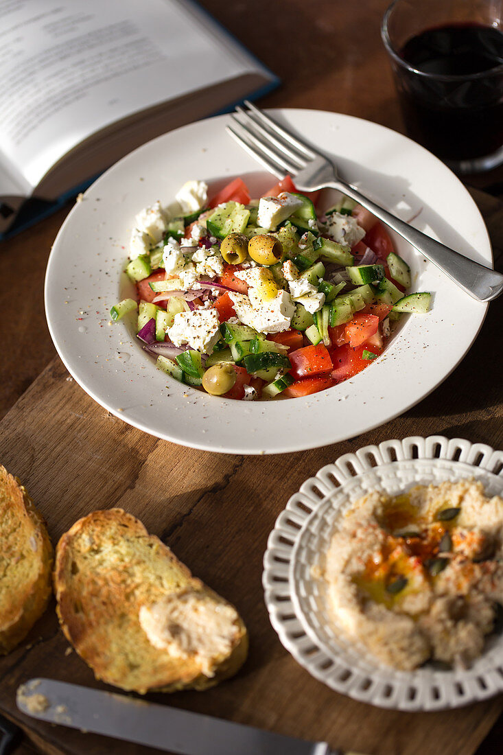 Greek salad with hummus and toasted bread