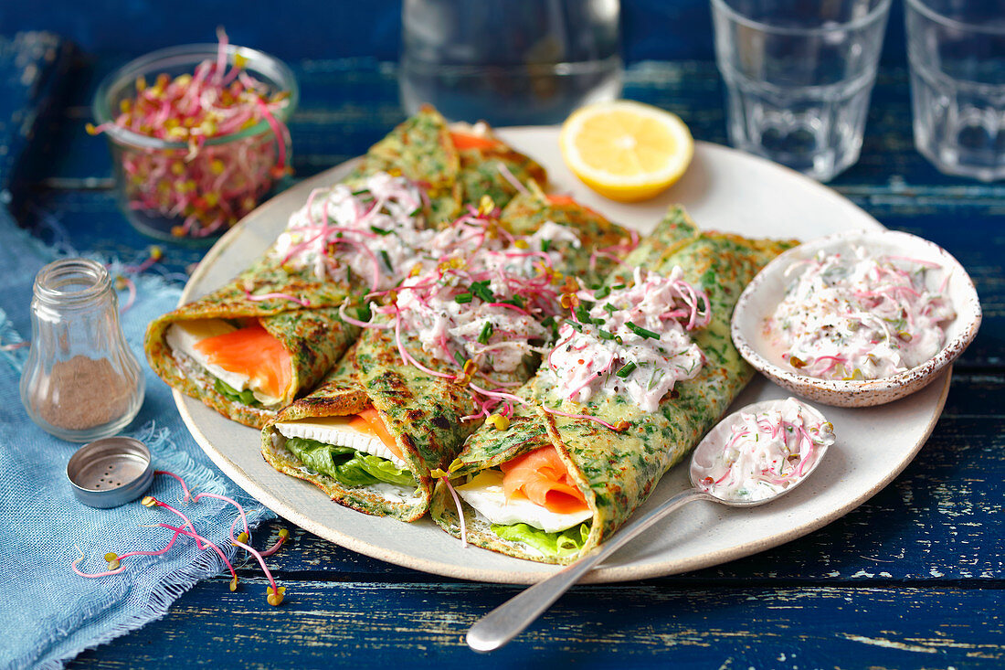 Spinach pancakes with camembert, smoked salmon and red radishes with yogurt