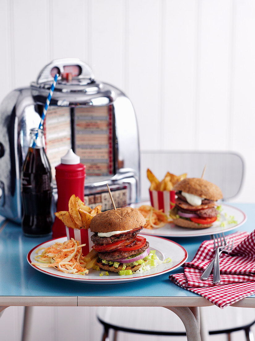 Burgers with fries and coleslaw in a diner (USA)