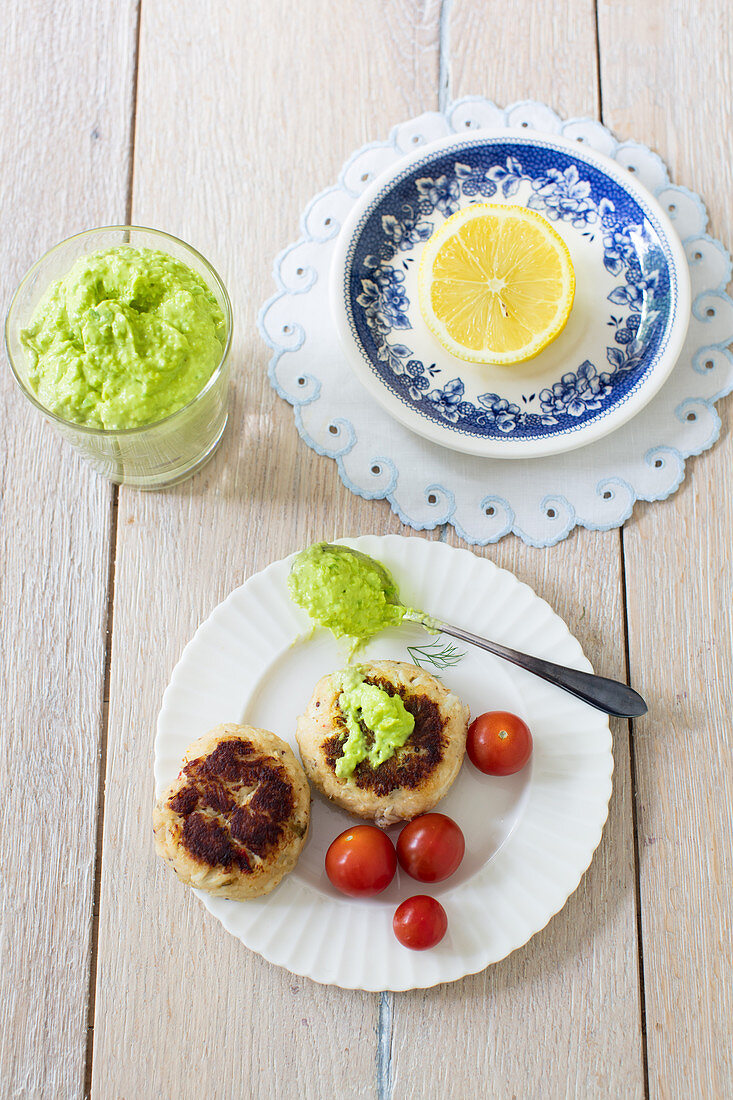 Crab cakes with tomato sauce and avocado dip