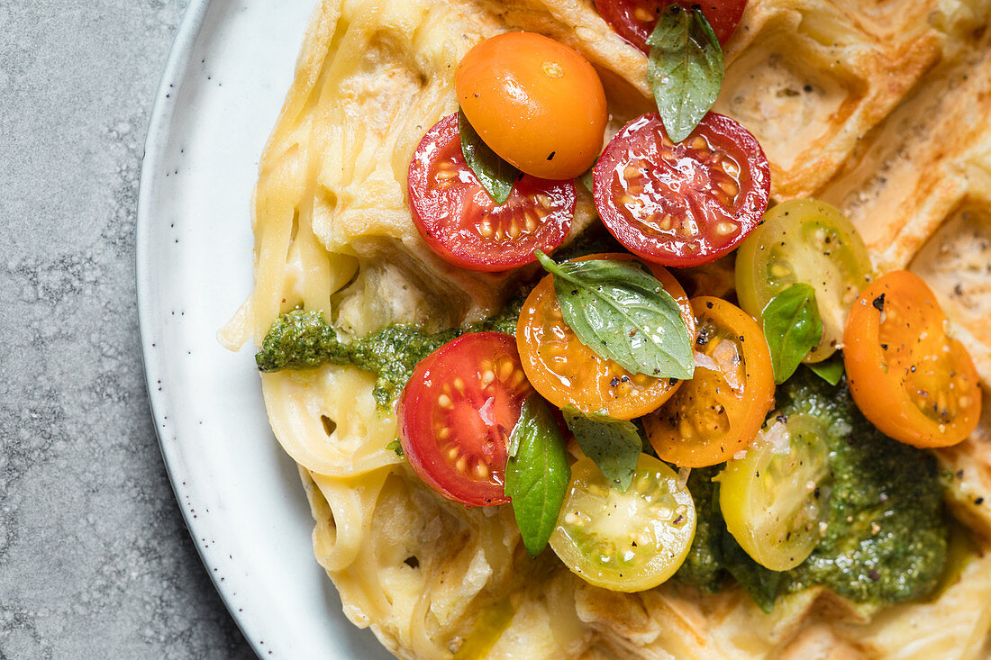 A vegetarian pasta waffle with pesto