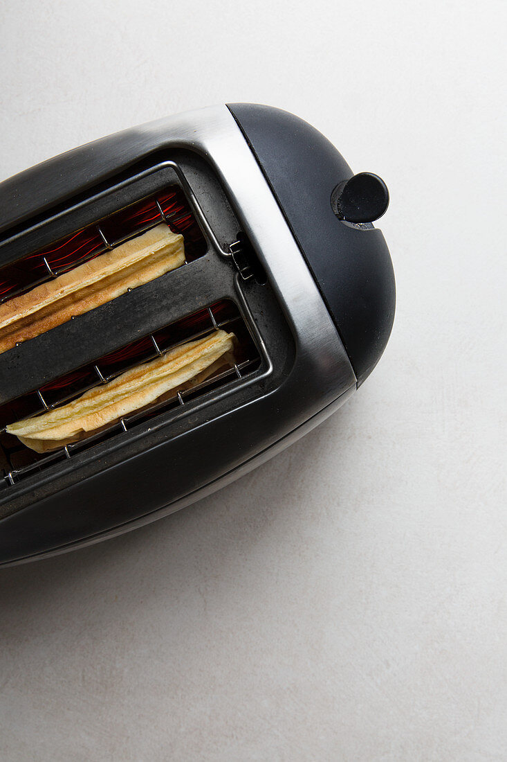 Waffles being toasted in a toaster