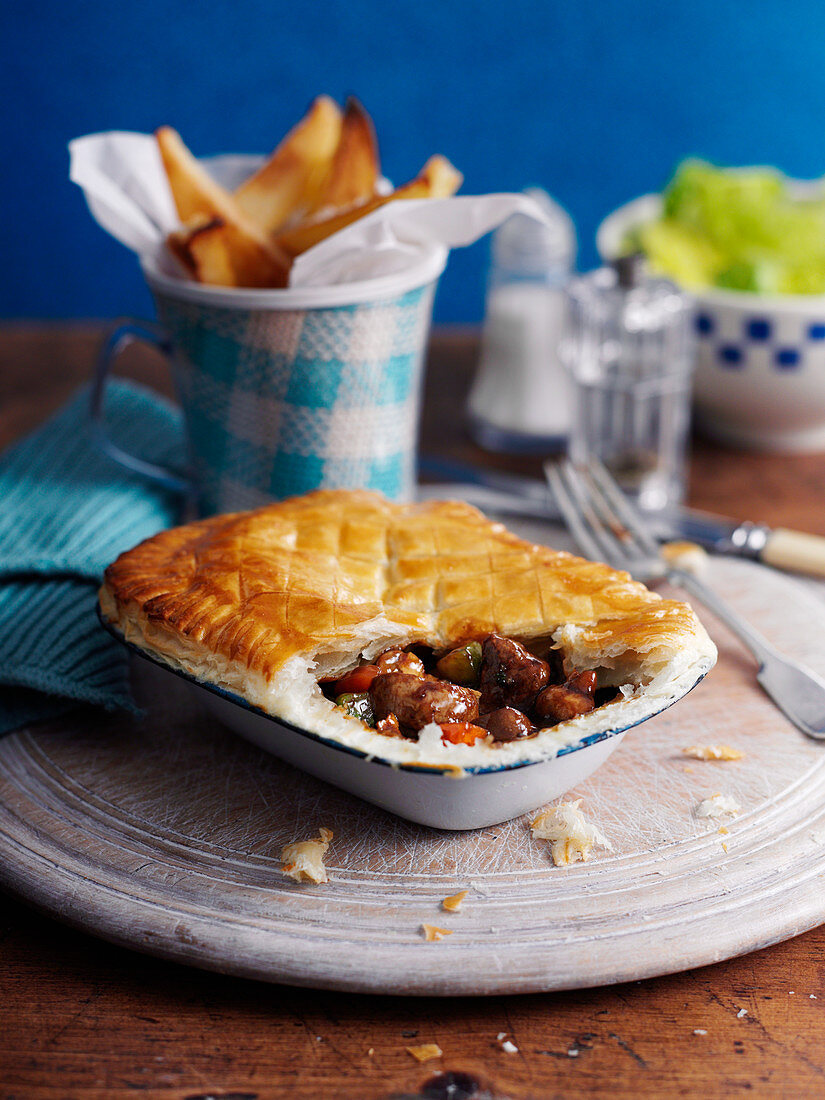 Steak and kidney pie with chips (England)