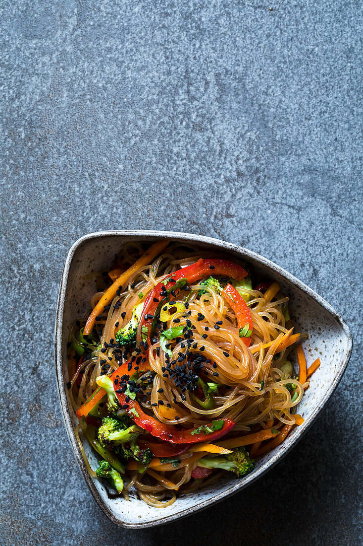 Oriental glass noodle salad with vegetables and black caraway