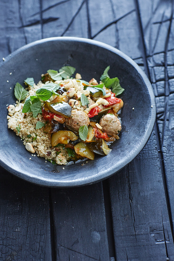 Couscous tagine with meatballs and cashew nuts