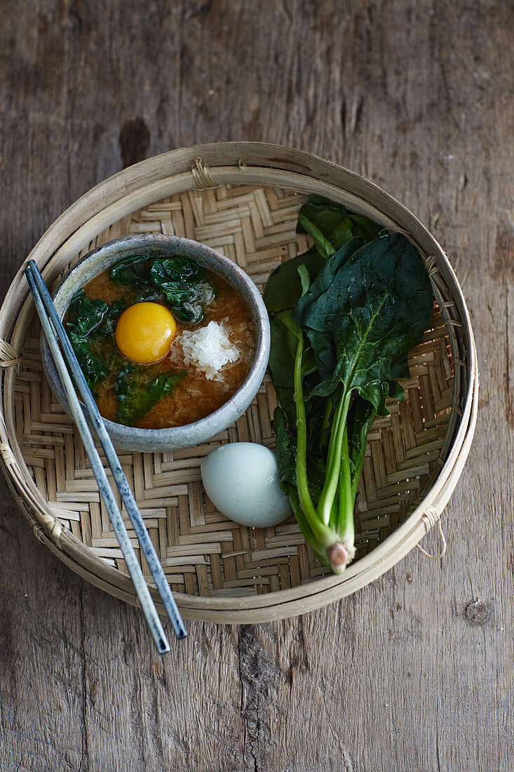 Miso soup with grated radish, spinach and egg