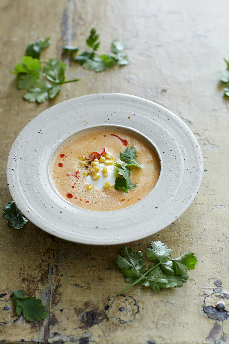 Corn chowder with sour cream and pepper oil